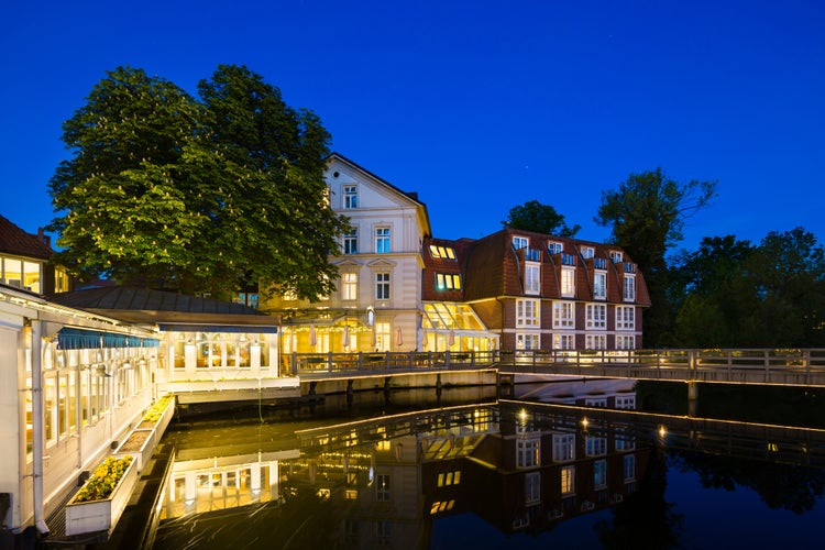 Photo of Old restaurant and hotel at the Ilmenau River in the old town of Lueneburg, Germany 