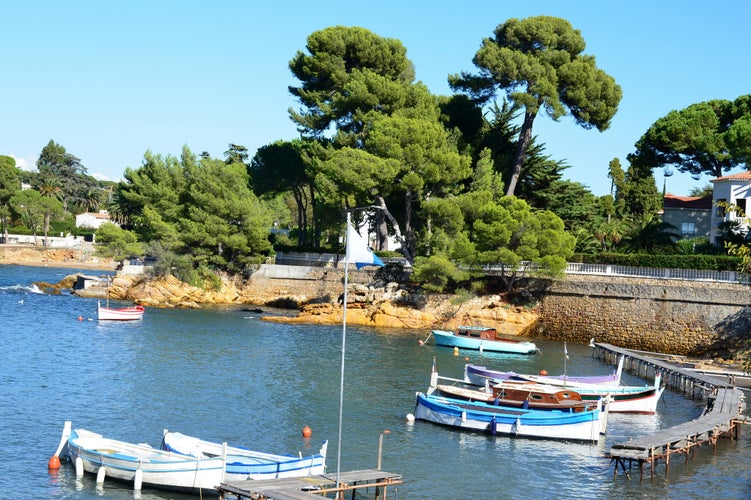 photo of view of France, french riviera, cape of Antibes, port of Olivette. In this small port located in the west of the Antibes cape, the typical boats are at anchorage from may to october.