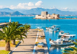 Photo of a small island with a fortress at the coast of Nafplio ,Greece.