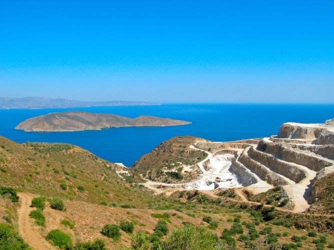 Photo of landscape and seascape of Crete island with a view of gypsum quarry. Open quarry is located at Altsi in Sitia.