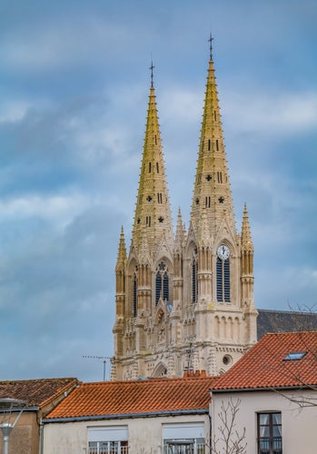 photo of view of A picture of the towers of the Notre-Dame Church of Cholet, France.