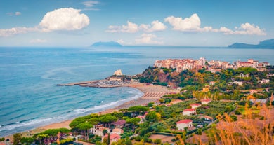 Photo of Umbrellas and sunbeds in San Felice Circeo, Italy.