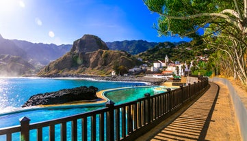 Photo of panoramic aerial view of idyllic coastal village of Porto da Cruz Madeira island, Portugal.