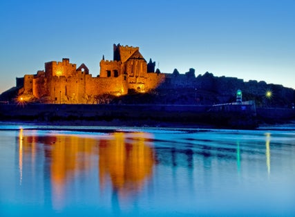 Peel Castle floodlit on the west coast of the Isle of Man.