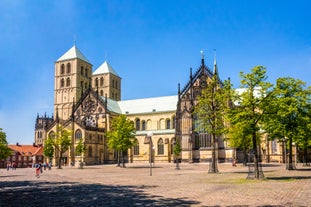 Photo of scenic summer view of the German traditional medieval half-timbered Old Town architecture and bridge over Pegnitz river in Nuremberg, Germany.