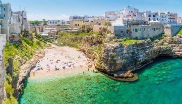 Photo of panoramic view of the ancient town of Matera (Sassi di Matera), European Capital of Culture 2019, in beautiful golden morning light with blue sky and clouds, Basilicata, southern Italy.