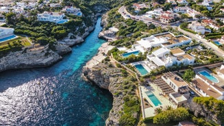 Photo of Cala Macarelleta in Ciutadella Menorca at turquoise Balearic Islands, Spain.