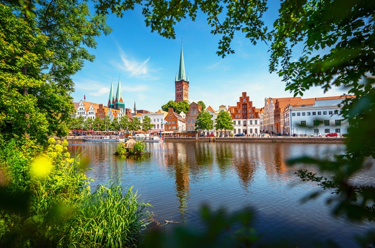 photo of  view  of Classic panoramic view of historic skyline of hanseatic town of Lübeck with famous St. Mary's Church on a beautiful sunny day with blue sky in summer, Schleswig-Holstein, Germany