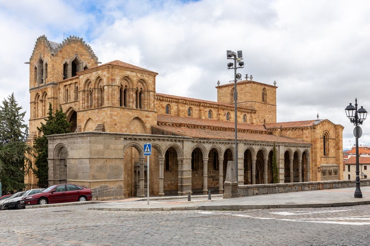 photo of view of Basilica of San Vicente in Avila, Spain, (The Basilica de los Santos Hermanos Martires, Vicente, Sabina y Cristeta), Romanesque architecture church building, exterior view.