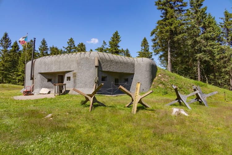 RICKY V ORLICKYCH HORACH, CZECH REPUBLIC (CZECHIA) – JULY 6, 2024: Infantry blockhouse R-S 89 "Prusek" with Czech hedgehogs on a sunny day, Hradec Kralove Region (Královéhradecký kraj)