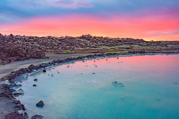 photo of view of Midnight sun over the Blue Lagoon geothermal spa, near Grindavik, Reykjanes peninsula, Iceland/