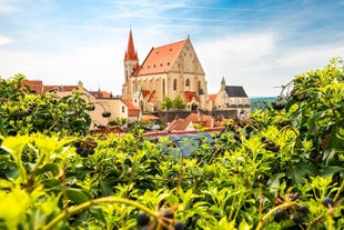 Photo of Lednice Chateau with beautiful gardens and parks on a sunny summer day, Czech Republic.