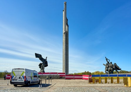 photo of Riga, Latvia - May 8, 2022: Victory park (Uzvars parks) decorated with Latvian and Ukrainian flags. The police are on duty.