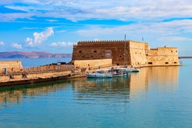 Photo of aerial view of Malia beach and small island with Church of Transfiguration, Heraklion, Crete, Greece.