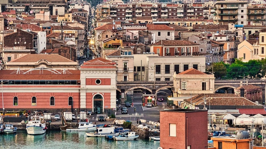 Exploring the bustling streets near Catania-s harbor offers a glimpse of historic charm and urban life..jpg