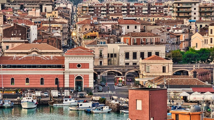 Exploring the bustling streets near Catania-s harbor offers a glimpse of historic charm and urban life..jpg
