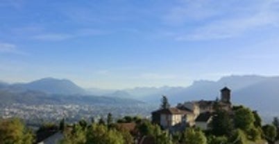 Photo of morning cityscape view with mountains, river and bridge in Grenoble city on the south-east of France.