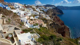 Photo of scenic aerial view of Kamari village and beach at sunrise, Greece.