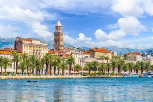 Photo of panorama and landscape of Makarska resort and its harbour with boats and blue sea water, Croatia.