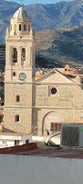 photo of Almuñécar, Spain - A scenic view of a coastal city with white buildings and a blue ocean in the background.