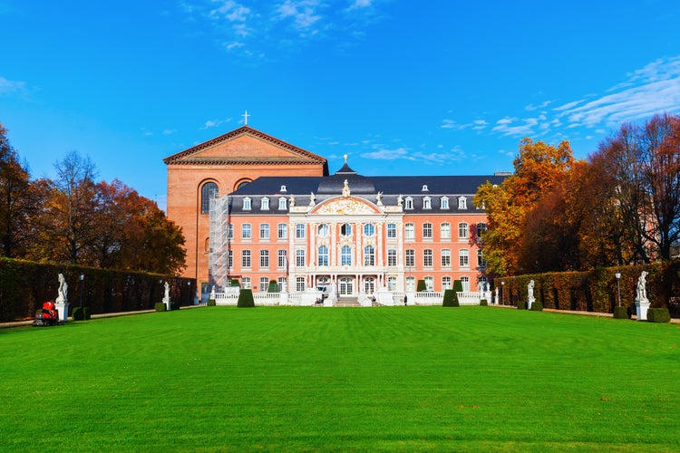 Photo of TRIER, GERMANY - NOVEMBER 05, 2015: electoral palace with unidentified people. It is a renaissance and rococo building from 17th century, where formerly the archbishop-electorals of Trier resided.