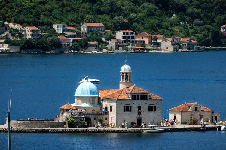 photo of view of Sveti Stefan is a tiny island in the Adriatic Sea that is home to a luxurious resort and a picturesque fishing village, Cetinje, Montenegro.