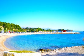 Photo of panorama and landscape of Makarska resort and its harbour with boats and blue sea water, Croatia.