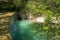 PHOTO OF Beautiful waterfall in the famous wood of Saint Francis in Assisi, umbria region, Italy