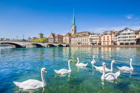 Panoramic view of historic Zurich city center with famous Fraumunster, Grossmunster and St. Peter and river Limmat at Lake Zurich on a sunny day with clouds in summer, Canton of Zurich, Switzerland