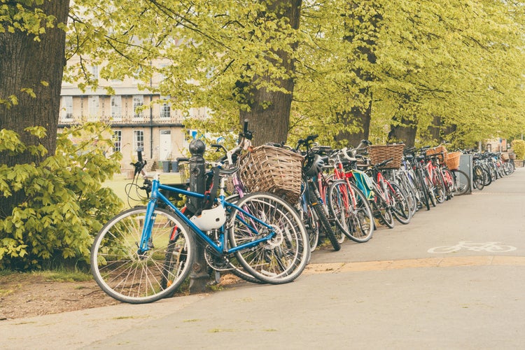 Conceptual image of student life in Cambdrige, bikes locked next to Parker's piece, England closeup