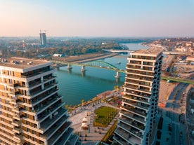 Antique building view in Old Town Bucharest city - capital of Romania and Dambrovita river. Bucharest, Romania, Europe.