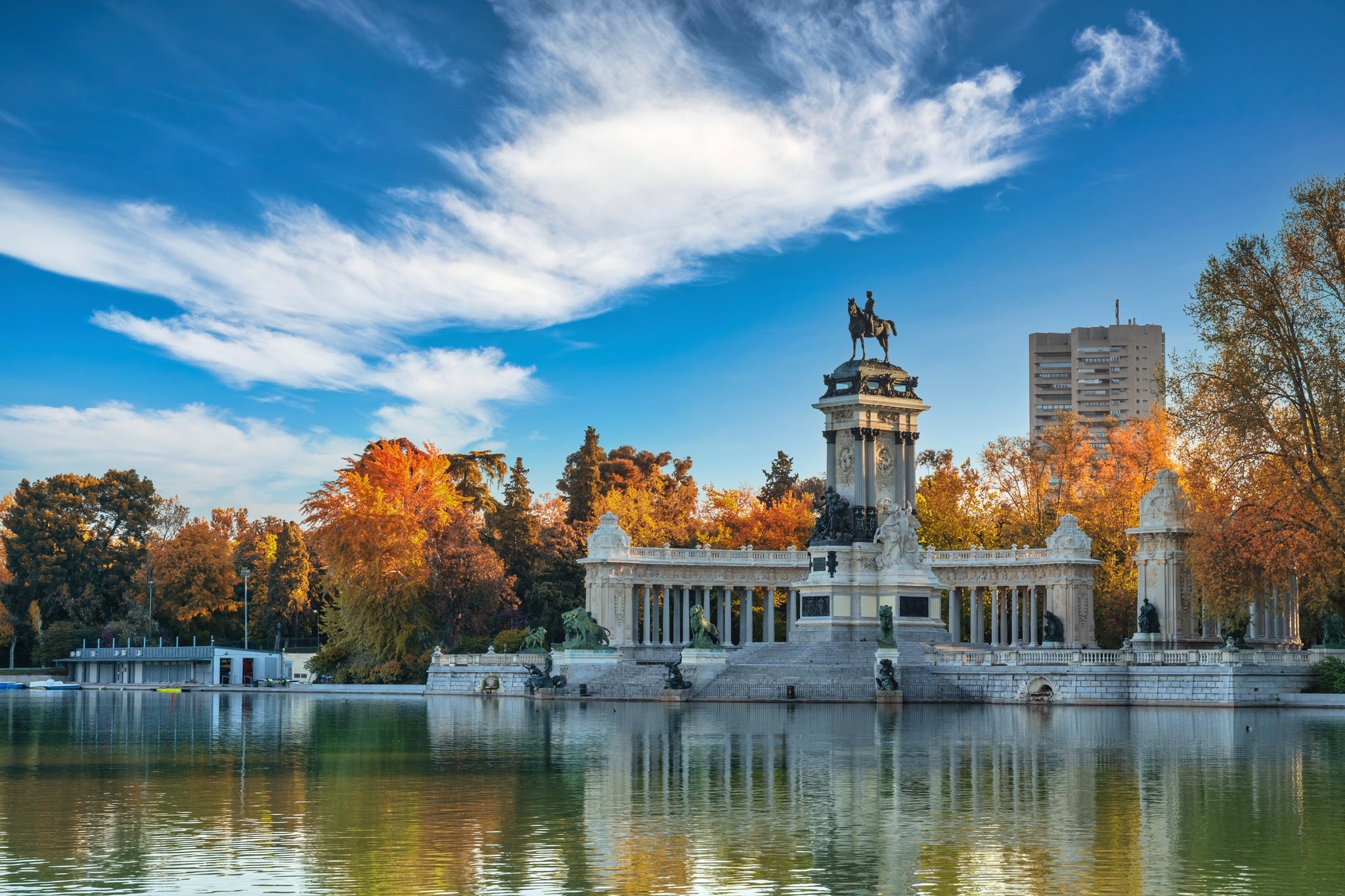 Madrid Spain, sunrise city skyline at El Retiro Park with autumn foliage season.jpg