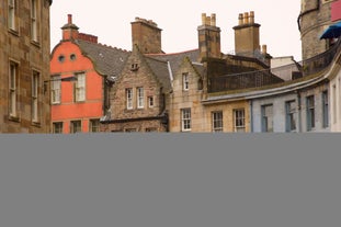 Photo of traditional architecture with shops and restaurants along a pedestrian street in Dunfermline town centre at sunset, Fife, Scotland, UK.