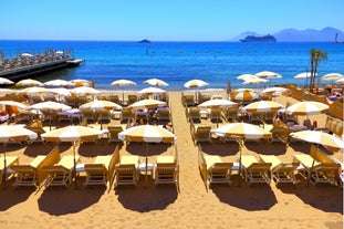 Photo of aerial cityscape view on French riviera with yachts in Cannes city, France.