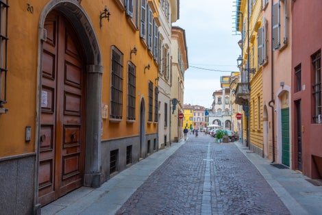 Photo of narrow street in the old town of Piacenza, Italy.
