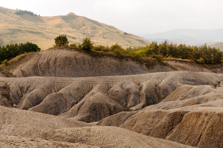 The surrounding landscape formed by the dried off volcanic mud - a geological reservation located in Scorțoasa commune, Buzău County in Romania.