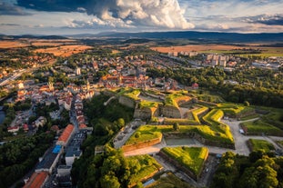 Photo of Lednice Chateau with beautiful gardens and parks on a sunny summer day, Czech Republic.