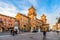 photo of Castle Estense (Castello Estense) and piazza Savonarola and monumet to Savonarola in Ferrara, Emilia-Romagna, Italy. Ferrara is capital of the Province of Ferrara