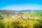 photo of village in small valley in sunny day and blue sky, Puente Viesgo, Spain.