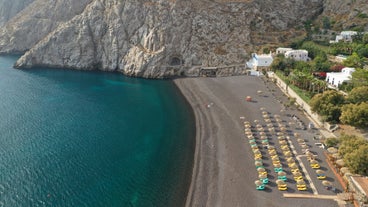 Photo of beautiful White architecture of Oia village on Santorini island, Greece.