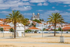 Photo of wide sandy beach in white city of Albufeira, Algarve, Portugal.