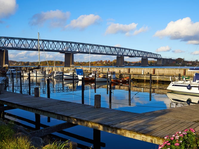 photo of view of Old Little Belt Bridge and small town of Middelfart Denmark Scandinavia travel destination.