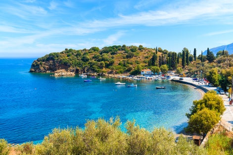 Photo of beautiful bay with fishing port on Samos island, Greece.