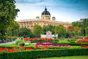 Photo of Lednice Chateau with beautiful gardens and parks on a sunny summer day, Czech Republic.