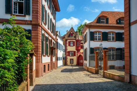 Photo of street and colorful houses in the historical Old Town in Basel city center, Switzerland.