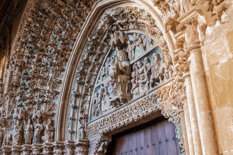 Photo of detail of the entrance frieze to Saint Mary the real church in Teobaldos square, city of Olite. Navarre Spain.