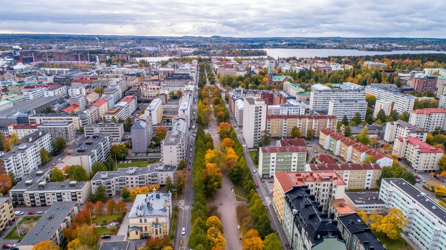 Photo of aerial autumn view of the Tampere city in autumn with colorful leaves, Finland.