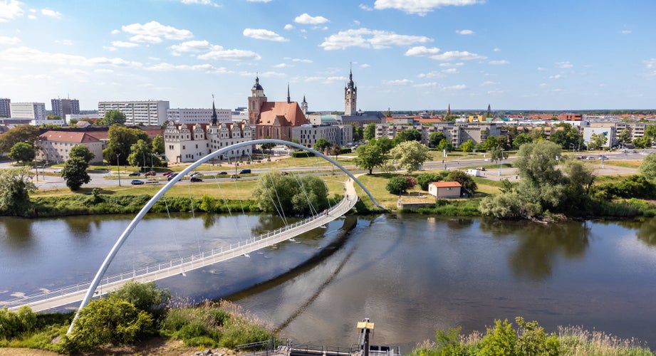 Photo of view of the elbe river with dessau town .