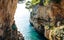 Photo of Sea canyon with high sheer cliffs descending to turquoise water, place for jump in Verudela Canyon at Verudela Peninsula, south from Pula, Croatia.