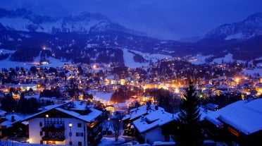 photo of the romantic, Snow covered Skiing Resort of Cortina d Ampezzo in the Italian Dolomites seen from Tofana with Col Druscie in the foreground.